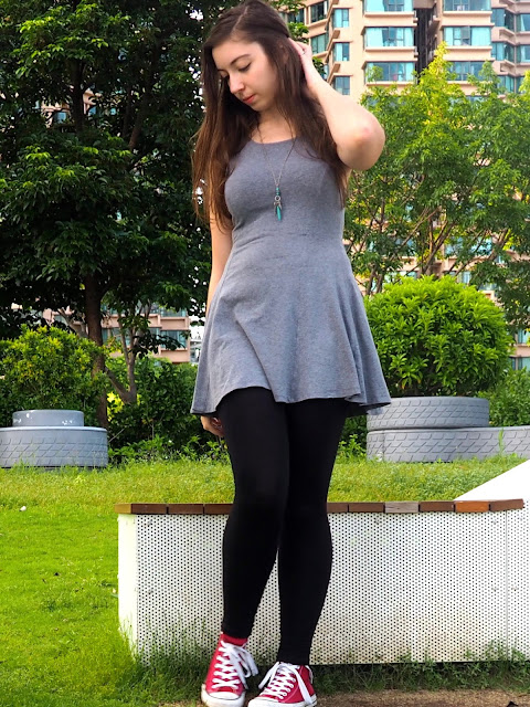 On The Move | outfit of short grey skater dress, black leggings, and red high top Converse