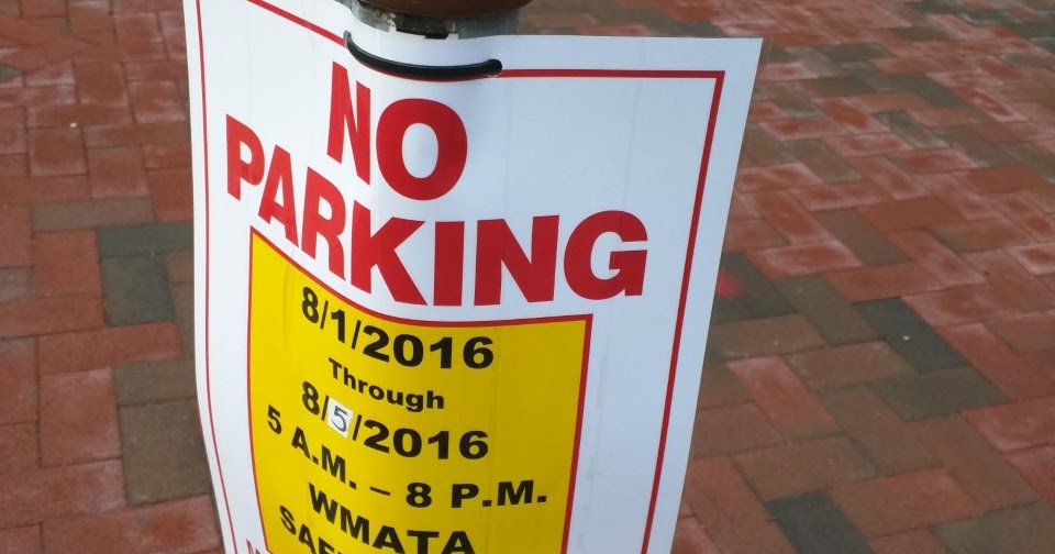 Robert Dyer Bethesda Row Signs posted banning parking on Wisconsin