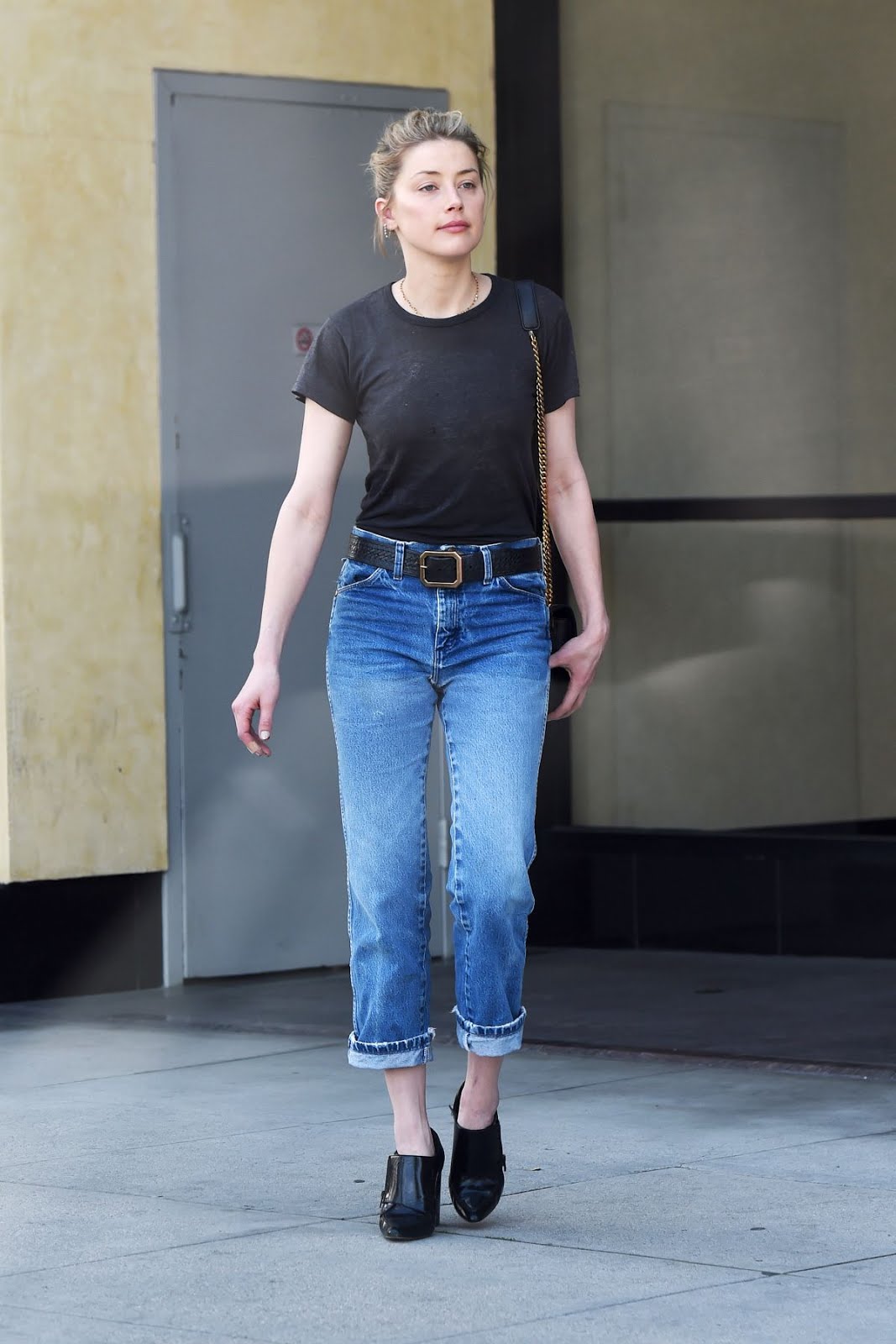 Amber Heard expose her breast in black shirt and blue jeans as she out