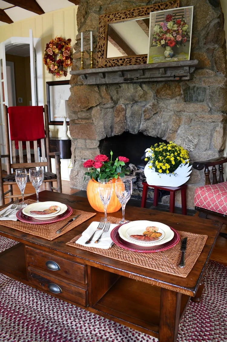 Rustic Fall Table For Two in front of a stone fireplace