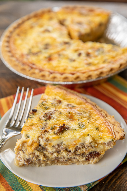 Hissy Fit Quiche - you will definitely throw a hissy fit if you miss out on this quiche! Inspired by our favorite tailgate dip! Sausage, muenster cheese, Velveeta, sour cream, onion, garlic, Worcestershire, eggs, heavy cream. Can make ahead and freeze unbaked for later. SO good! I always have to double the recipe. Never any leftovers! #quiche #brunch #breakfast #freezermeals Hissy Fit Quiche - you will definitely throw a hissy fit if you miss out on this quiche! Inspired by our favorite tailgate dip! Sausage, muenster cheese, Velveeta, sour cream, onion, garlic, Worcestershire, eggs, heavy cream. Can make ahead and freeze unbaked for later. SO good! I always have to double the recipe. Never any leftovers! #quiche #brunch #breakfast #freezermeals
