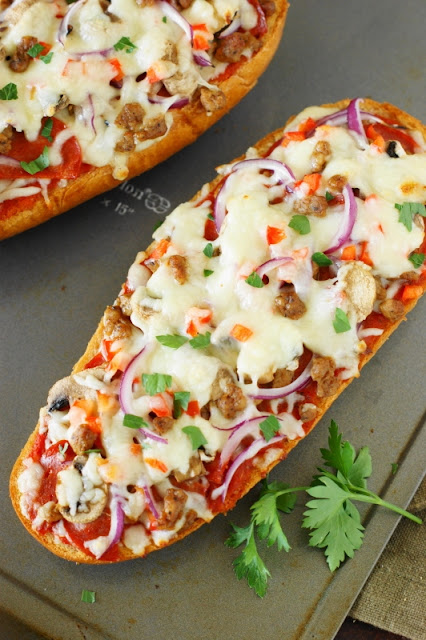 Looking for a perfect game-day snack or easy dinner idea to add to your arsenal?  Look no further than this easy Supreme French Bread Pizza.  Loaded with great taste and ready in under 20 minutes start-to-finish, it's sure to become a family favorite!