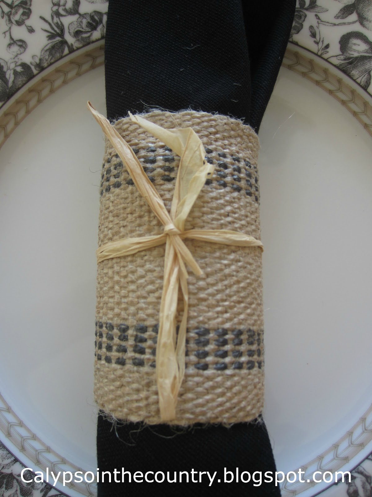 Black and White Fall Table -Using homemade napkin rings with raffia 