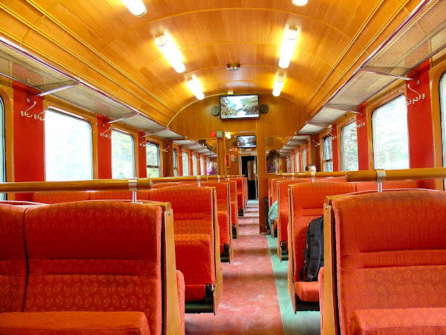 Newly refurbished interiors of the Flåm Railway coaches. You can see the monitors in each of the cars that recount your journey and provide historical background on the railway. Don't you love the colors?