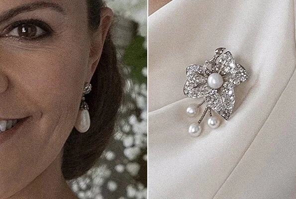 Crown Princess Victoria wore white drop pearl earrings, and pearl diamond brooch