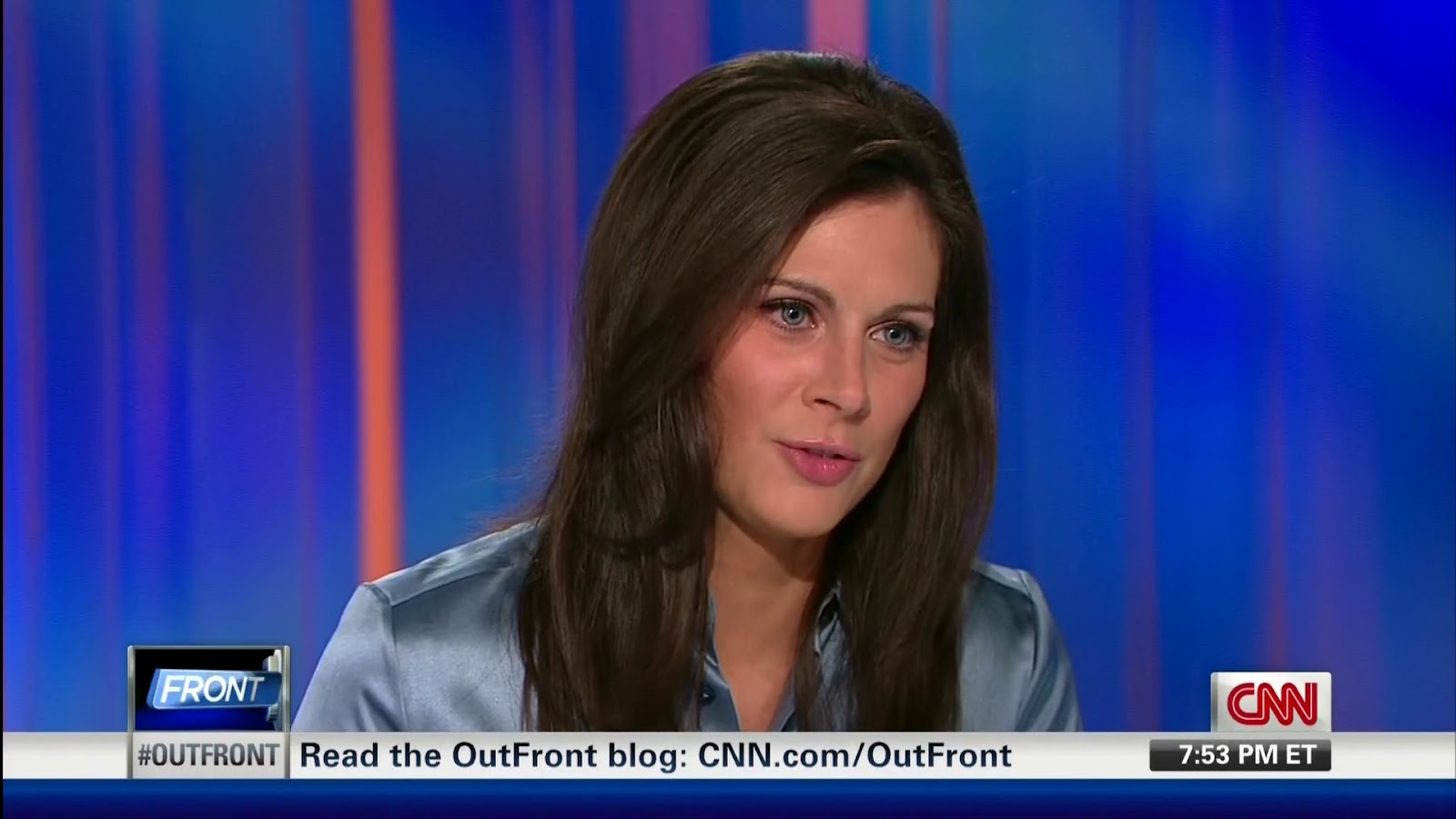 Erin Burnett - bluish-silver satin blouse.