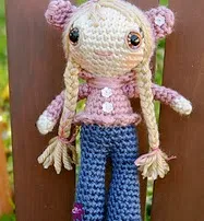 http://www.ravelry.com/patterns/library/doll-in-bear-hoodie