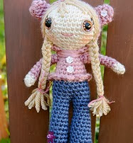 http://www.ravelry.com/patterns/library/doll-in-bear-hoodie