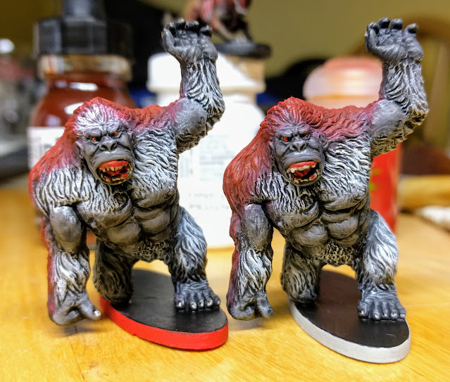 Front view of two painted Blood Apes