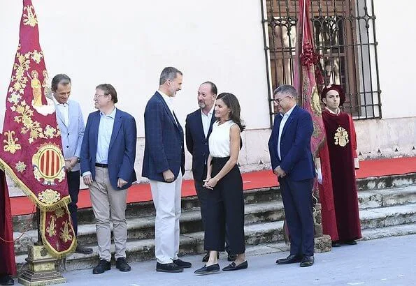 Queen Letizia wore Hugo Boss Iyabo silk top, Boss cropped wide leg trousers and hugo boss Italian-leather flats