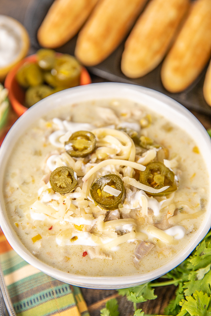 Chicken & Corn Chowder - crazy delicious and ready in 30 minutes! Chicken, onion, garlic, cumin, chicken broth, half-and-half, pepper jack cheese, corn kernels, creamed corn and green chiles. I wanted to lick the bowl! Great for a crowd. Top the chowder with some sour cream, jalapeños and extra cheese. All you need is some cornbread and you are set! The BEST!! #chicken #soup #chickensoup Chicken & Corn Chowder - crazy delicious and ready in 30 minutes! Chicken, onion, garlic, cumin, chicken broth, half-and-half, pepper jack cheese, corn kernels, creamed corn and green chiles. I wanted to lick the bowl! Great for a crowd. Top the chowder with some sour cream, jalapeños and extra cheese. All you need is some cornbread and you are set! The BEST!! #chicken #soup #chickensoup