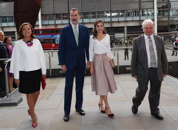 Queen Letizia carried Mirtha Natural clutch wore Lodi burgundy suede ankle strap pumps, Hugo Boss skirt and blouse. Queen Elizabeth