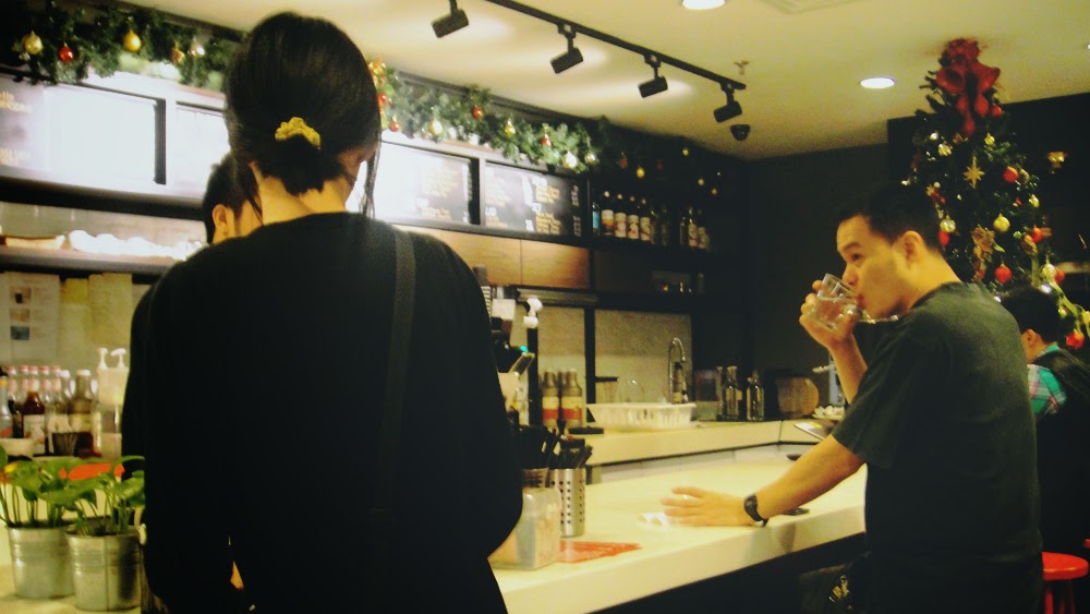 This is likely going to get me in trouble, because I hit the shutter at that precise moment. Or, I could've waited for the barista to show up.