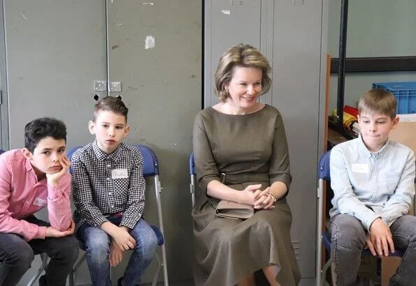 Queen Mathilde visited the 'Fly to the Moon' project of Maison des Ateliers Mons. Natan dress and Armani wool coat