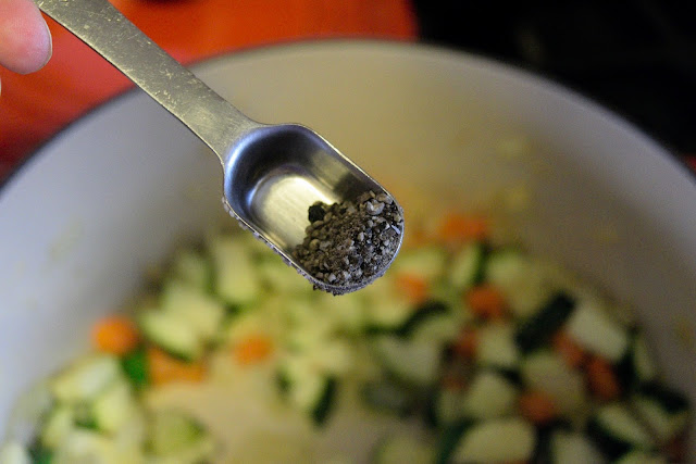 Pepper being added to the pot. 