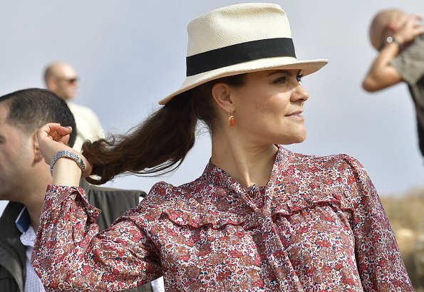 Crown Princess Victoria is wearing Ruffle-trimmed floral-print silk blouse and, Caroline Svedbom gold earrings