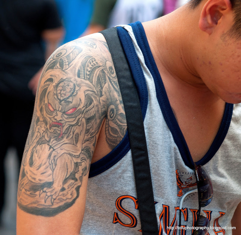 man with an alien tattoo in pratunam bangkok thailand in june 2011 title=