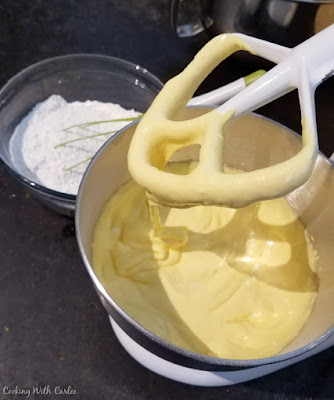 creamy egg yolk mixter in mixer bowl