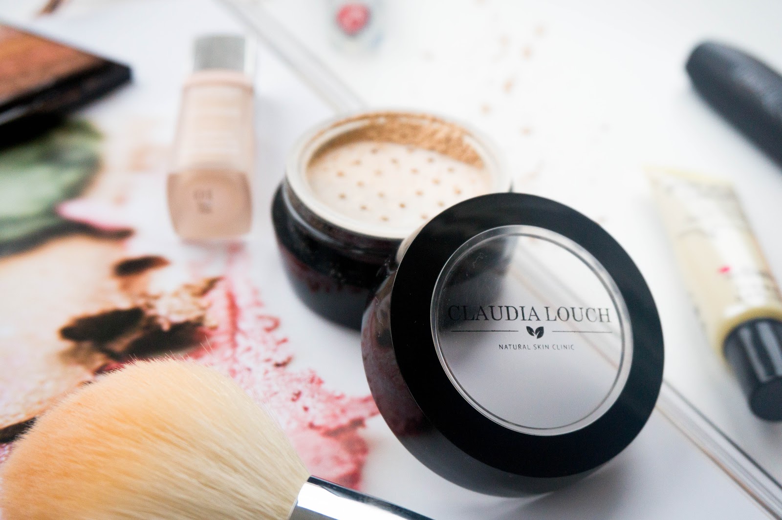 A Super Natural Spring Makeup Edit A Super Natural Spring Makeup Edit, Guerlain La Petit Robe Noir Lipstick, Claudia Louch Mineral Loose Powder
