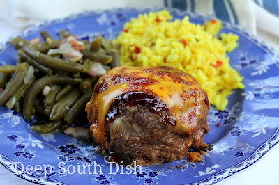 Mini meatloaves, made in a jumbo, Texas style muffin pan, with lean ground beef, the Trinity of veggies, barbecue sauce, topped with a brown sugar, Creole mustard barbecue glaze and finished with cheese.