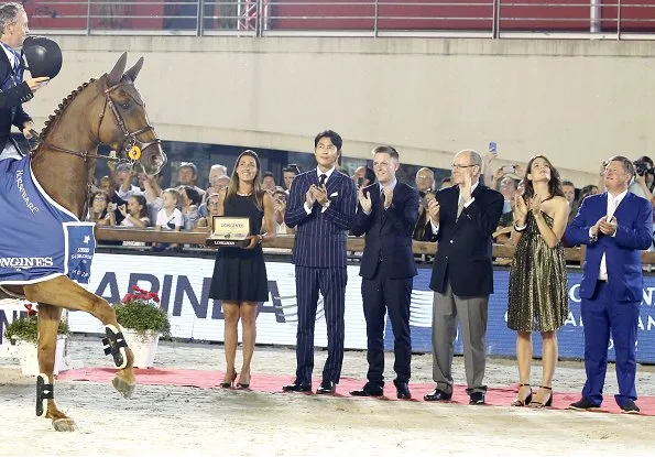 Prince Albert of Monaco and Charlotte Casiraghi attended award ceremony of Monaco Longines Global Champions Tour 2018. Charlotte wore Gucci dress