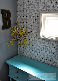 Small entry with pops of turquoise and yellow with geometric patterned wallpaper :: OrganizingMadeFun.com