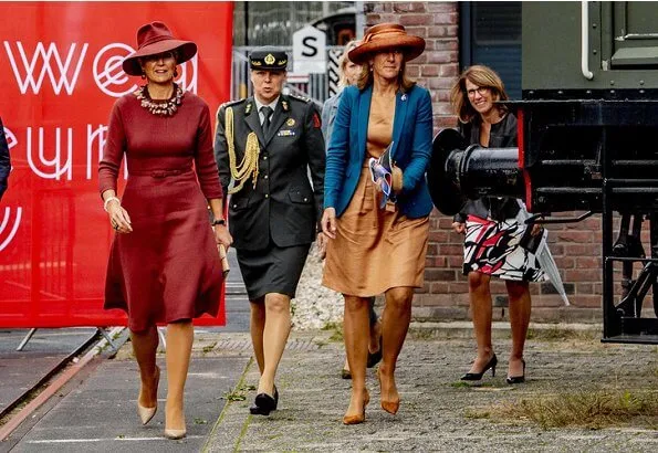 Queen Maxima wore Natan burgundy belted midi dress, and Delvigne hat, Natan pumps