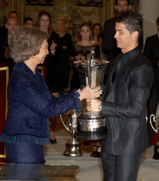 Queen Sofia presents Real Madrid's player Cristiano Ronaldo with the Ibero-American Community Trophy