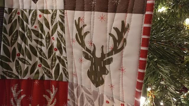 Christmas deer quilt using Merrily by Moda and Aurifil thread