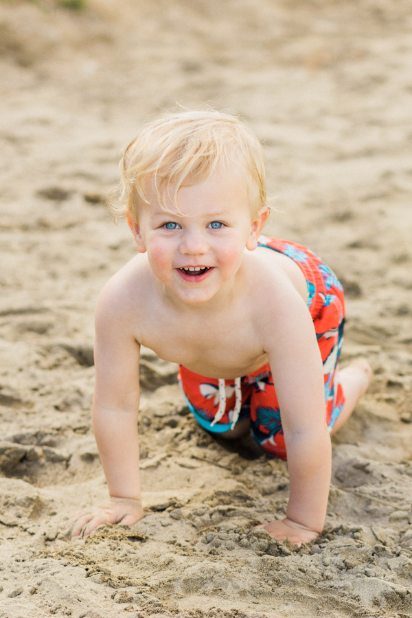blonde-haired, blue-eyed toddler / Gap Kids swim trunks