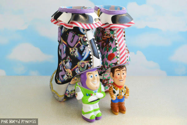 Irregular Choice Toy Story ankle boots with Buzz and Woody character heels left back angle of ankle boots with Toy Story character heels and sky wallpaper background