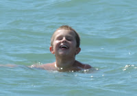swimming in solent grinning boy