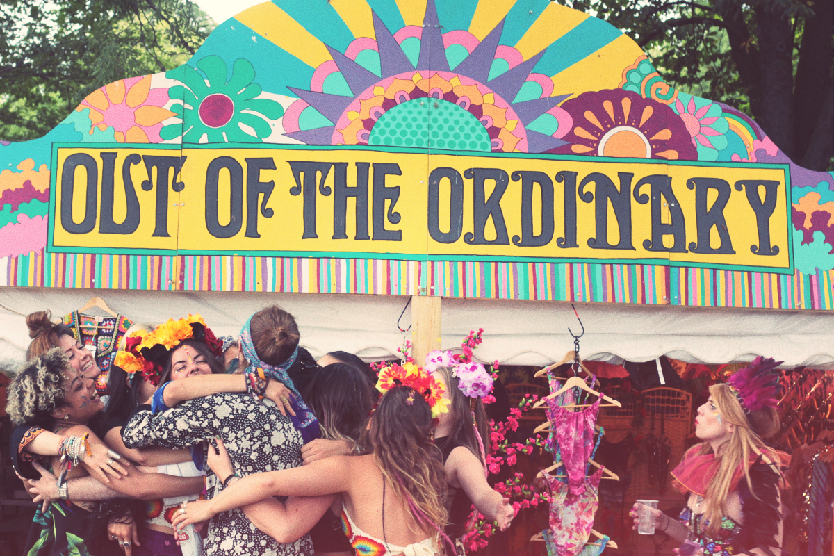 out of the ordinary, lovebox, festival, 70's, hippies, festival signage, stall
