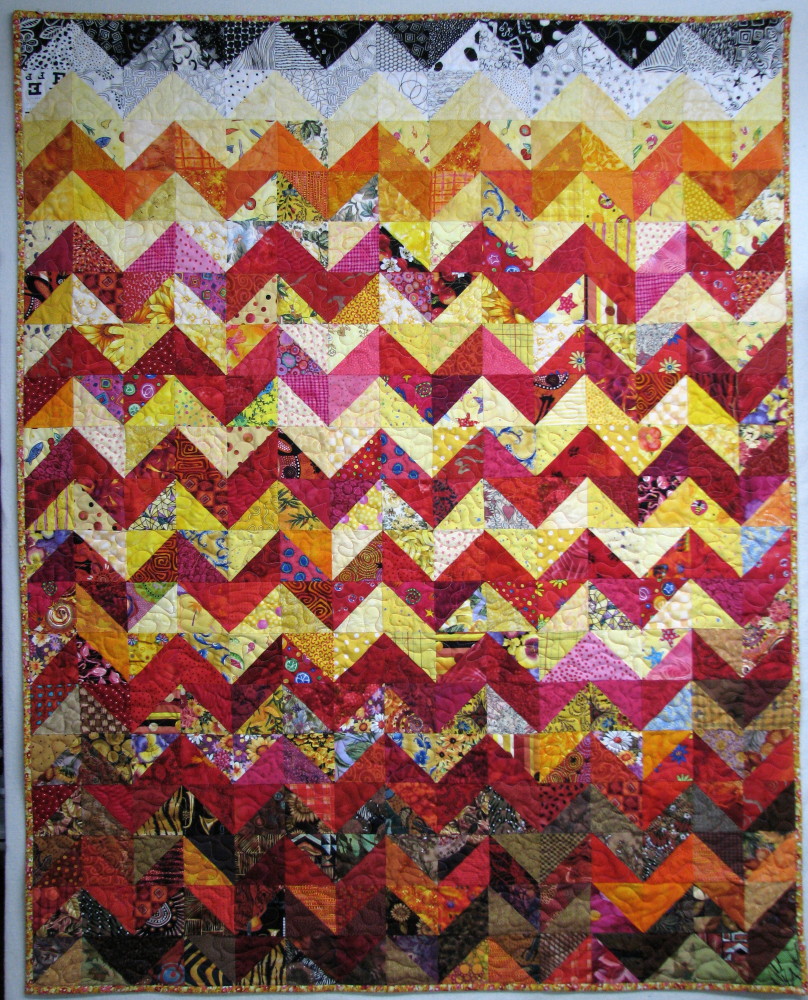 Exuberant Color Quilts made with triangles