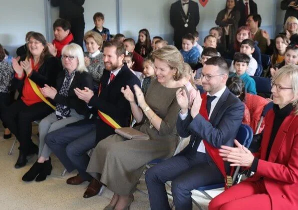 Queen Mathilde visited the 'Fly to the Moon' project of Maison des Ateliers Mons. Natan dress and Armani wool coat
