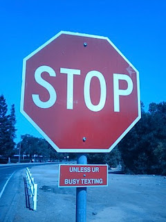 funny stop sign unless busy texting