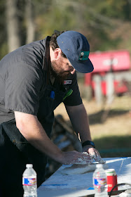 Jay Ducote makes biscuit dough at Mahaffey Farms for the Pineywoods Supper Club