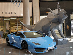 Lamborghini and Triceratops sculpture display at City of Dreams Macau