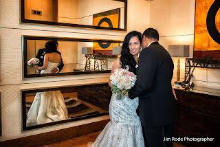 bride and groom in the mirrored lobby of the Hotel Palomar Dallas - Jim Rode Dallas Wedding Photographer