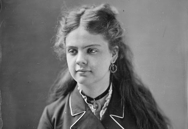 A portrait of Miss E. Demine, taken by photographer Mathew Brady.