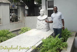 Standing probably on the spot where Bishop Samuel Ajayi Crowther was first buried at the then 'Ajele Cemetery' but today a part of that cemetery is now been used as secondary school "Eko Akete Grammar School" and the other part is now Campos Mini Stadium Igbosere. Ajele Cemetery was a major cemetery on Lagos Island demolished by the Lagos State military government under Brigadier Mobolaji Johnson in December 1971. Bishop Samuel Ajayi Crowther's body was later exhumed for proper burial now at the CMS Cathedral Church Compound.