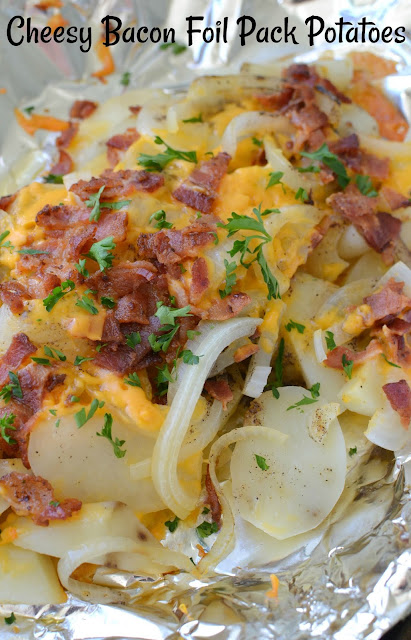 Grill or Oven Cheesy Bacon Foil Pack Potatoes Recipe from Hot Eats and Cool Reads! A delicious breakfast, lunch or dinner side! Perfect for camping or a BBQ at home! Serve with eggs for breakfast, or with pork, chicken or beef for dinner!