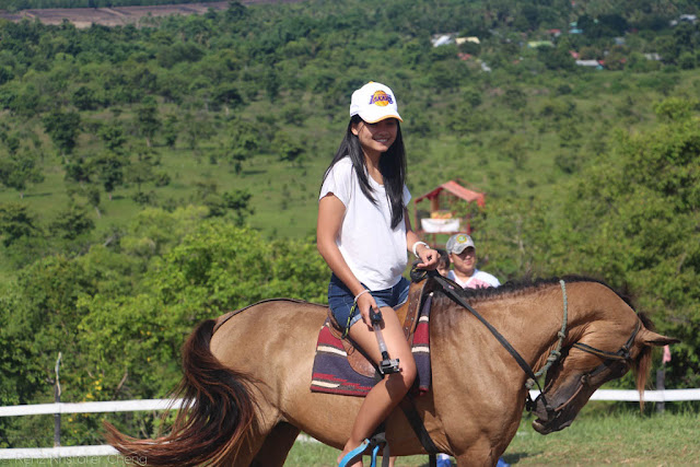 Andrea Gonzales riding a horse in Palawan - Mitra's Ranch