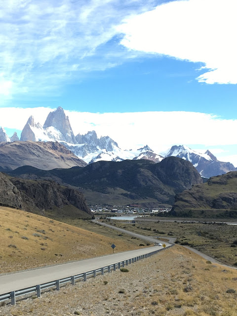 Patagonia: Like Falling in Love. Winding road down into village of El Chalten winding road down into small town overlooked my white topped mountains
