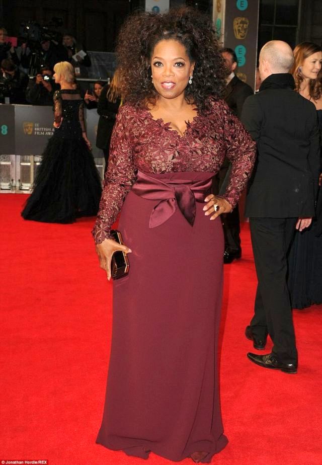 Oprah Winfrey in a berry-coloured Stella McCartney gown at the BAFTA 2014