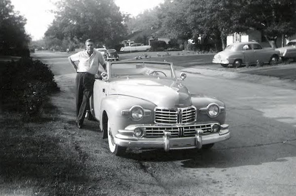 Posing with his Lincoln convertible