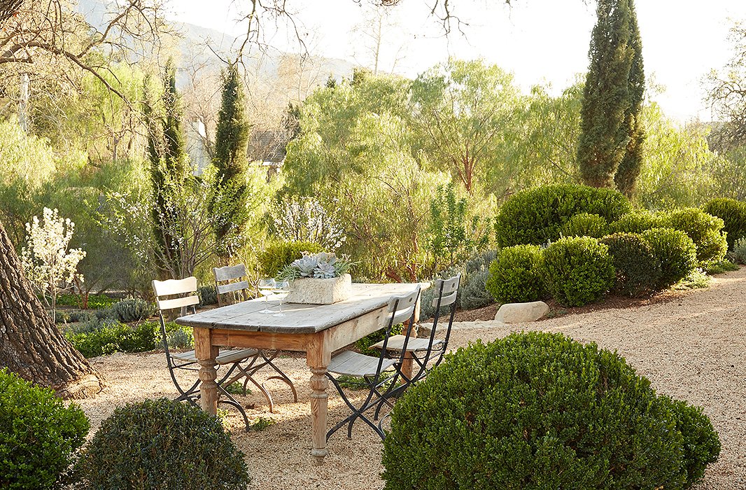 Beautiful modern farmhouse outdoor dining area on gravel at Patina Farm...decor inspiration on Hello Lovely Studio