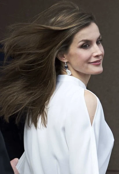 Queen Letizia wore Adolfo Dominguez short sleeve cold shoulder blouse and Hugo Boss Skirt