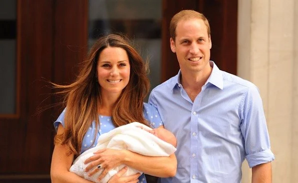 Hello world! A newborn Prince George is shown off by his proud parents in July 2013