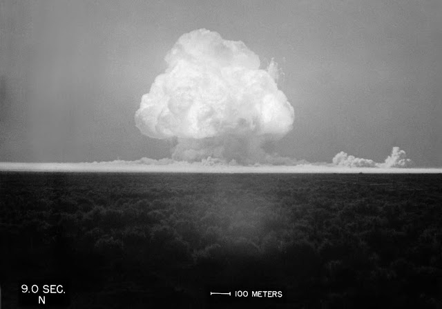A fireball begins to rise, and the world's first atomic mushroom cloud begins to form, nine seconds after Trinity detonated on July 16, 1945.